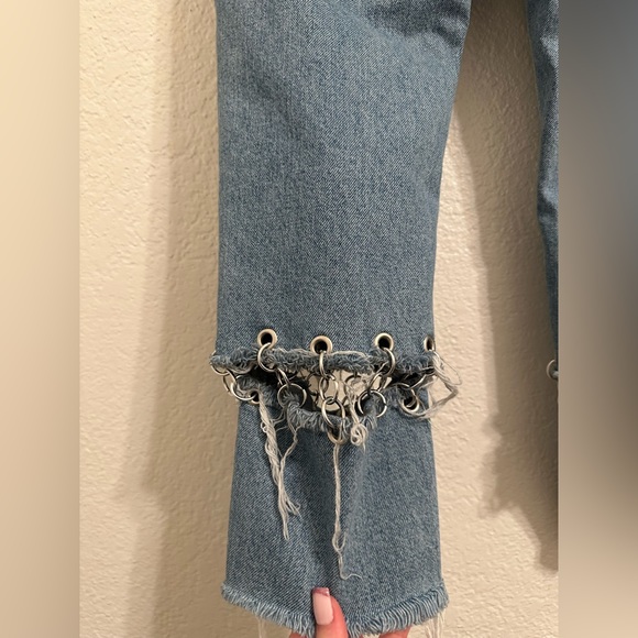 Jeans are cropped at the ankle and wide in the waist. - Picture 7 of 9